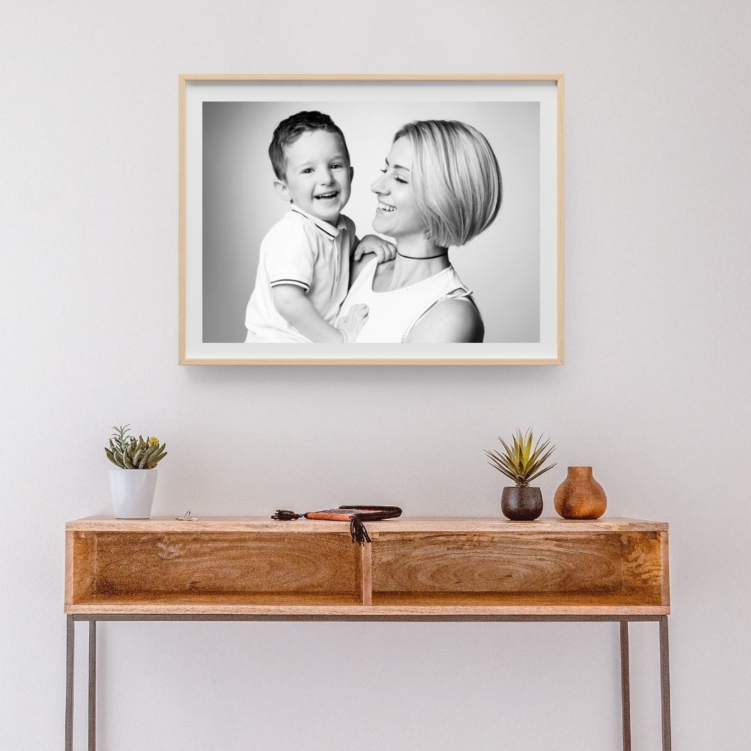 Framed 20 inch black and white wall portrait of a mother and son