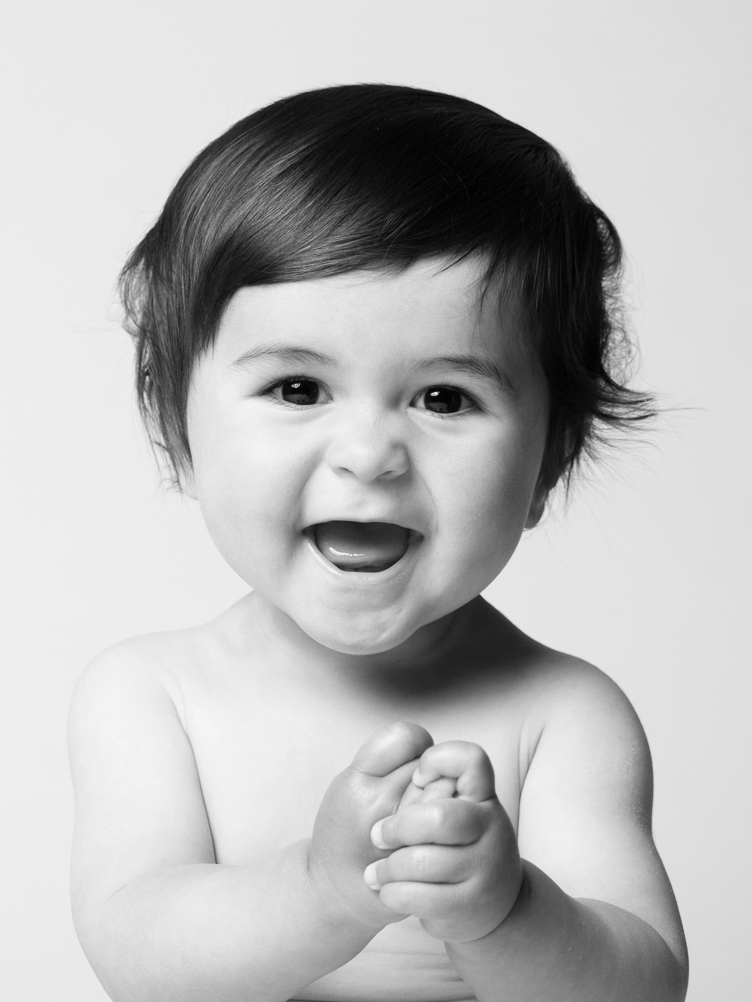 Baby laughing and clapping, black and white