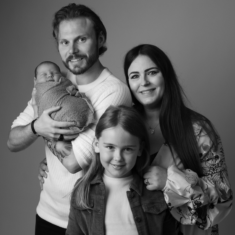 Parents with their newborn, black and white