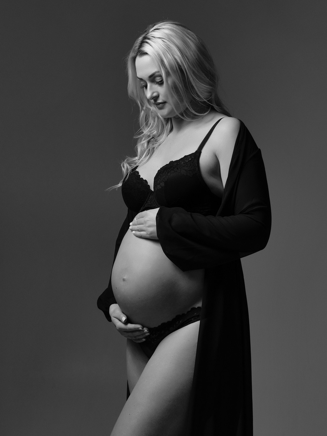 Mum-to-be in a sheer black robe, black and white