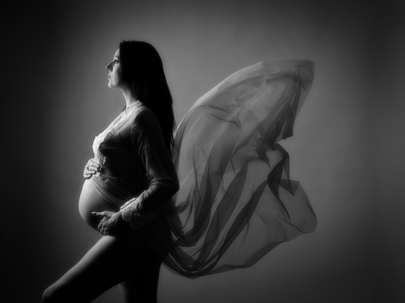 Mum-to-be with flowing fabric, black and white