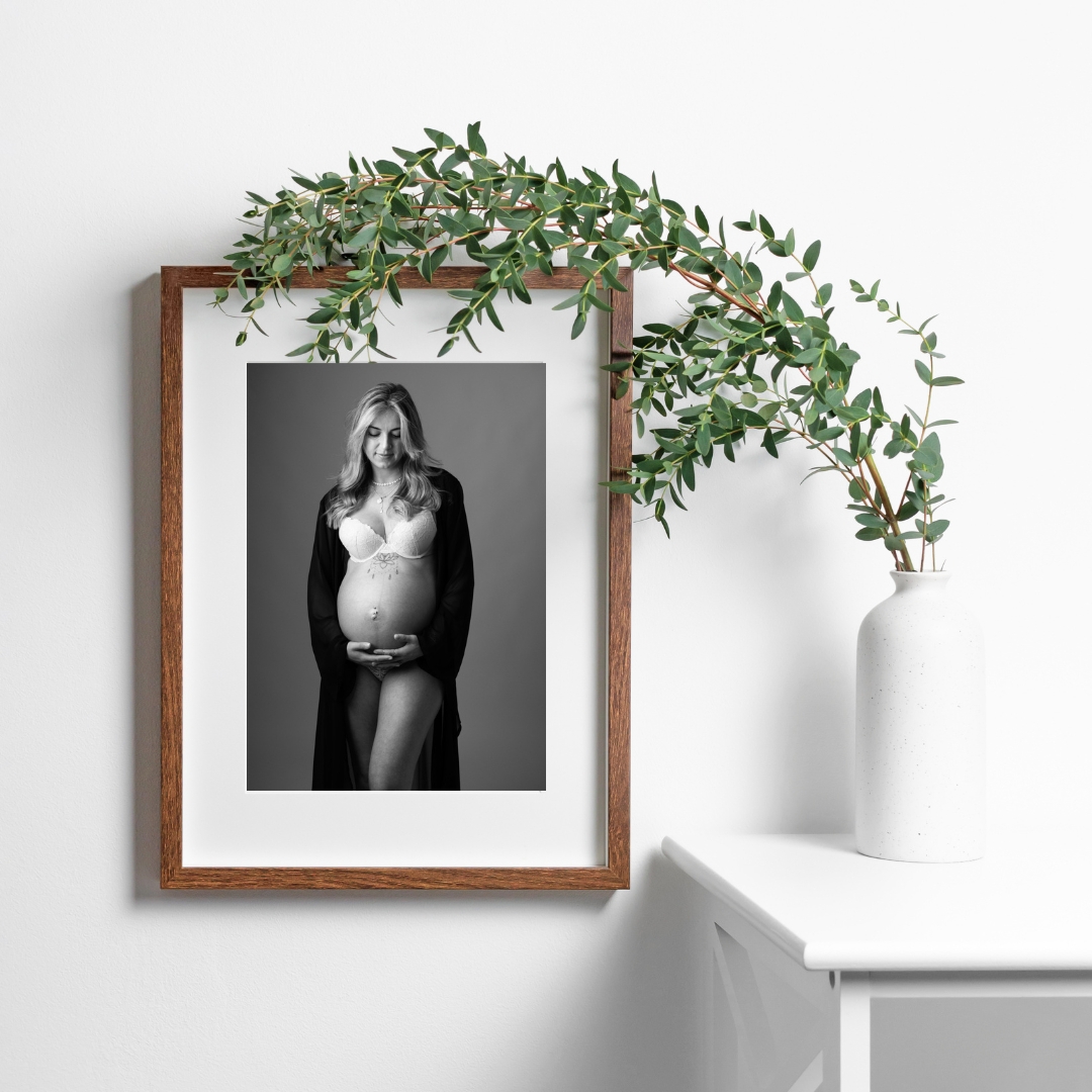 Framed black and white maternity portrait with eucalyptus